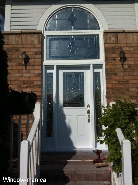 Entrance Front door installation. Half glass and two full sidelights. Matching rectangular transom and round top transom. Stockport stained glass. Beveled Glass with silver caming